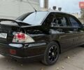 Чорний Міцубісі Lancer, об'ємом двигуна 1.58 л та пробігом 386 тис. км за 4450 $, фото 5 на Automoto.ua