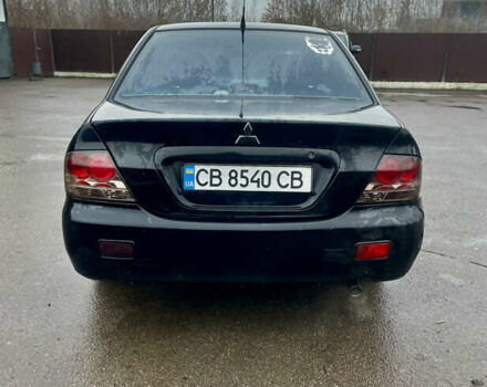 Чорний Міцубісі Lancer, об'ємом двигуна 1.59 л та пробігом 305 тис. км за 2950 $, фото 5 на Automoto.ua