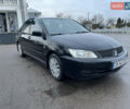 Чорний Міцубісі Lancer, об'ємом двигуна 1.58 л та пробігом 196 тис. км за 3800 $, фото 13 на Automoto.ua