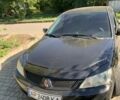 Чорний Міцубісі Lancer, об'ємом двигуна 1.6 л та пробігом 300 тис. км за 4200 $, фото 1 на Automoto.ua