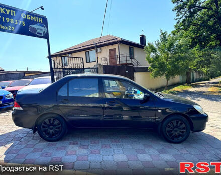 Черный Мицубиси Лансер, объемом двигателя 1.6 л и пробегом 300 тыс. км за 3599 $, фото 4 на Automoto.ua