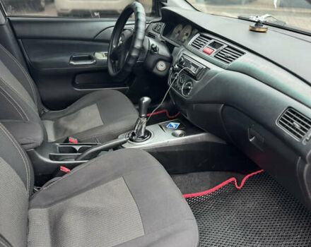 Черный Мицубиси Лансер, объемом двигателя 1.58 л и пробегом 370 тыс. км за 3500 $, фото 10 на Automoto.ua