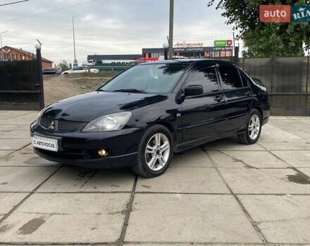 Чорний Міцубісі Lancer, об'ємом двигуна 2 л та пробігом 248 тис. км за 4990 $, фото 2 на Automoto.ua
