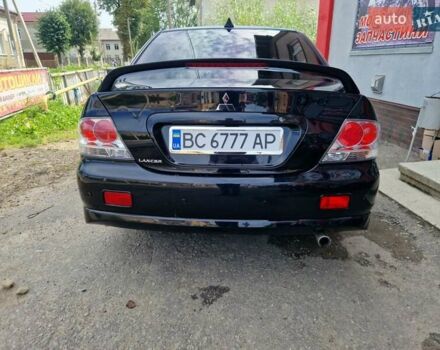 Черный Мицубиси Лансер, объемом двигателя 2 л и пробегом 168 тыс. км за 4999 $, фото 6 на Automoto.ua