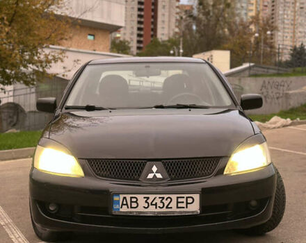 Чорний Міцубісі Lancer, об'ємом двигуна 1.58 л та пробігом 230 тис. км за 4350 $, фото 6 на Automoto.ua