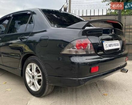 Чорний Міцубісі Lancer, об'ємом двигуна 2 л та пробігом 248 тис. км за 4990 $, фото 7 на Automoto.ua