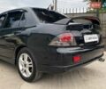 Чорний Міцубісі Lancer, об'ємом двигуна 2 л та пробігом 248 тис. км за 4990 $, фото 7 на Automoto.ua