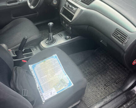 Чорний Міцубісі Lancer, об'ємом двигуна 1.58 л та пробігом 257 тис. км за 2400 $, фото 5 на Automoto.ua
