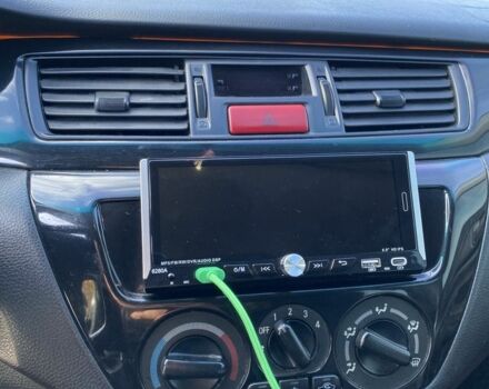 Черный Мицубиси Лансер, объемом двигателя 1.6 л и пробегом 200 тыс. км за 3400 $, фото 5 на Automoto.ua