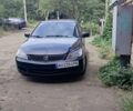 Черный Мицубиси Лансер, объемом двигателя 1.6 л и пробегом 250 тыс. км за 2083 $, фото 1 на Automoto.ua