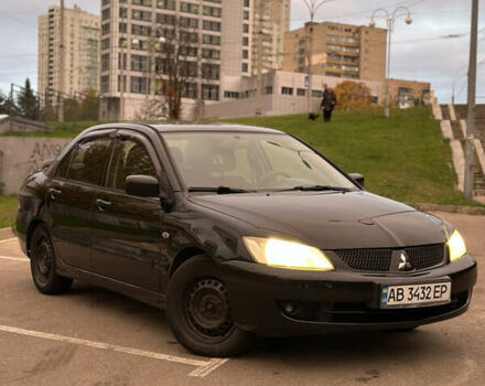 Чорний Міцубісі Lancer, об'ємом двигуна 1.58 л та пробігом 230 тис. км за 4350 $, фото 5 на Automoto.ua