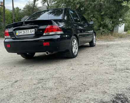 Чорний Міцубісі Lancer, об'ємом двигуна 1.6 л та пробігом 240 тис. км за 4599 $, фото 4 на Automoto.ua