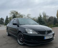 Чорний Міцубісі Lancer, об'ємом двигуна 2 л та пробігом 242 тис. км за 5900 $, фото 1 на Automoto.ua