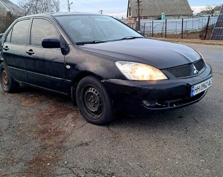 Чорний Міцубісі Lancer, об'ємом двигуна 1.6 л та пробігом 297 тис. км за 2100 $, фото 1 на Automoto.ua