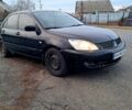 Чорний Міцубісі Lancer, об'ємом двигуна 1.6 л та пробігом 297 тис. км за 2100 $, фото 1 на Automoto.ua