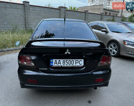Черный Мицубиси Лансер, объемом двигателя 2 л и пробегом 255 тыс. км за 5000 $, фото 11 на Automoto.ua