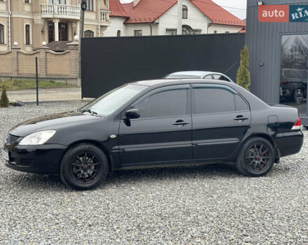 Чорний Міцубісі Lancer, об'ємом двигуна 1.58 л та пробігом 230 тис. км за 3350 $, фото 13 на Automoto.ua