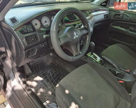 Чорний Міцубісі Lancer, об'ємом двигуна 1.58 л та пробігом 280 тис. км за 3950 $, фото 12 на Automoto.ua
