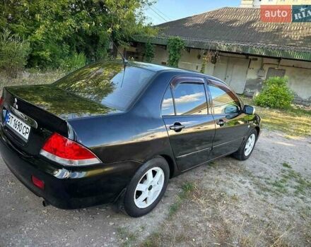 Мицубиси Лансер 2006 в Киеве на Automoto.ua Черный Мицубиси Лансер, объемом двигателя 1.58 л и пробегом 268 тыс. км за 3400 $, фото 14 на Automoto.ua