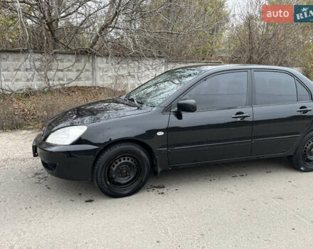 Чорний Міцубісі Lancer, об'ємом двигуна 1.58 л та пробігом 230 тис. км за 3350 $, фото 2 на Automoto.ua