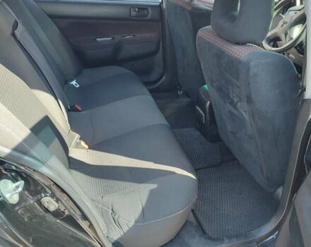 Черный Мицубиси Лансер, объемом двигателя 1.58 л и пробегом 128 тыс. км за 4600 $, фото 36 на Automoto.ua