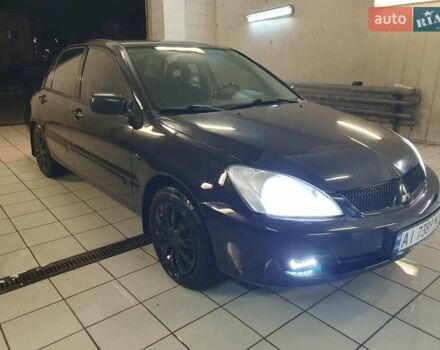Чорний Міцубісі Lancer, об'ємом двигуна 1.58 л та пробігом 222 тис. км за 2999 $, фото 1 на Automoto.ua