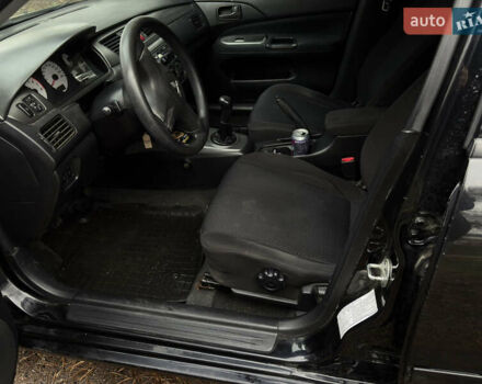 Чорний Міцубісі Lancer, об'ємом двигуна 1.58 л та пробігом 210 тис. км за 3900 $, фото 11 на Automoto.ua