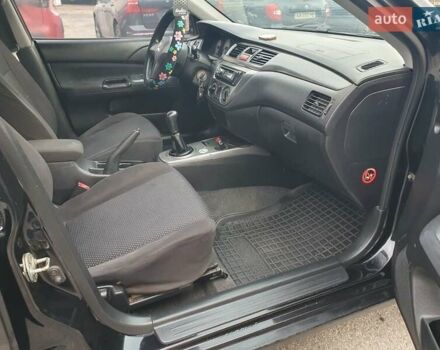 Черный Мицубиси Лансер, объемом двигателя 1.58 л и пробегом 222 тыс. км за 2999 $, фото 6 на Automoto.ua