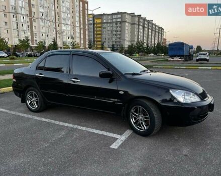 Чорний Міцубісі Lancer, об'ємом двигуна 1.58 л та пробігом 329 тис. км за 3500 $, фото 1 на Automoto.ua