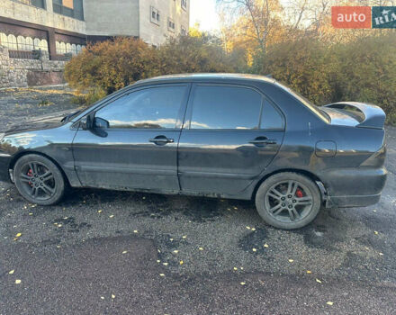 Чорний Міцубісі Lancer, об'ємом двигуна 2 л та пробігом 270 тис. км за 3300 $, фото 3 на Automoto.ua