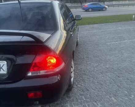 Черный Мицубиси Лансер, объемом двигателя 1.6 л и пробегом 231 тыс. км за 4250 $, фото 5 на Automoto.ua