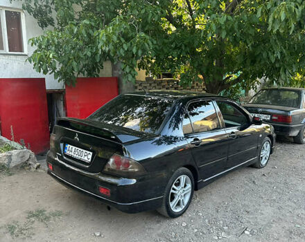 Черный Мицубиси Лансер, объемом двигателя 2 л и пробегом 255 тыс. км за 5000 $, фото 3 на Automoto.ua