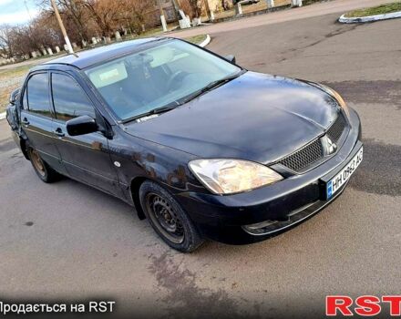 Чорний Міцубісі Lancer, об'ємом двигуна 1.6 л та пробігом 297 тис. км за 2100 $, фото 9 на Automoto.ua