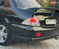 Міцубісі Lancer 2006 у Дніпро (Дніпропетровську) на Automoto.ua Чорний Міцубісі Lancer, об'ємом двигуна 2 л та пробігом 230 тис. км за 4900 $, фото 13 на Automoto.ua