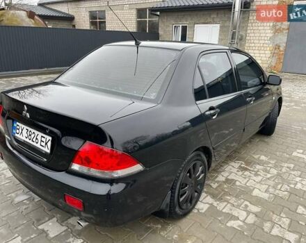 Чорний Міцубісі Lancer, об'ємом двигуна 1.58 л та пробігом 282 тис. км за 4100 $, фото 1 на Automoto.ua