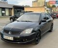 Чорний Міцубісі Lancer, об'ємом двигуна 2 л та пробігом 265 тис. км за 5200 $, фото 1 на Automoto.ua