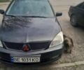 Черный Мицубиси Лансер, объемом двигателя 1.6 л и пробегом 260 тыс. км за 3800 $, фото 9 на Automoto.ua