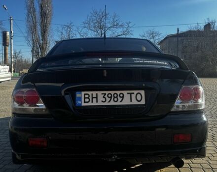 Черный Мицубиси Лансер, объемом двигателя 2 л и пробегом 285 тыс. км за 4100 $, фото 4 на Automoto.ua