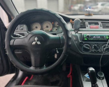 Черный Мицубиси Лансер, объемом двигателя 1.6 л и пробегом 368 тыс. км за 3200 $, фото 10 на Automoto.ua