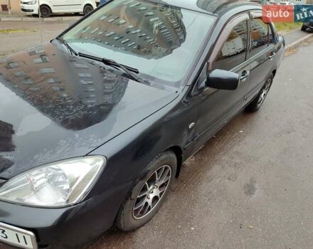 Черный Мицубиси Лансер, объемом двигателя 1.58 л и пробегом 270 тыс. км за 4000 $, фото 4 на Automoto.ua