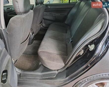 Чорний Міцубісі Lancer, об'ємом двигуна 1.58 л та пробігом 280 тис. км за 3950 $, фото 22 на Automoto.ua