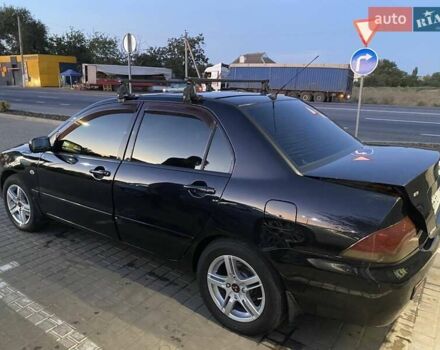 Черный Мицубиси Лансер, объемом двигателя 1.6 л и пробегом 257 тыс. км за 4500 $, фото 7 на Automoto.ua