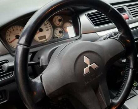 Черный Мицубиси Лансер, объемом двигателя 1.58 л и пробегом 246 тыс. км за 4200 $, фото 9 на Automoto.ua