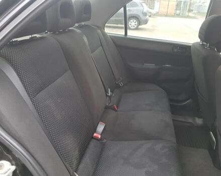 Черный Мицубиси Лансер, объемом двигателя 1.6 л и пробегом 290 тыс. км за 3200 $, фото 7 на Automoto.ua