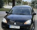 Чорний Міцубісі Lancer, об'ємом двигуна 1.6 л та пробігом 190 тис. км за 4516 $, фото 1 на Automoto.ua