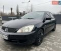 Чорний Міцубісі Lancer, об'ємом двигуна 1.58 л та пробігом 282 тис. км за 4100 $, фото 1 на Automoto.ua