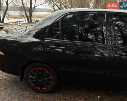 Чорний Міцубісі Lancer, об'ємом двигуна 1.58 л та пробігом 210 тис. км за 3900 $, фото 6 на Automoto.ua