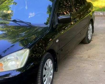 Черный Мицубиси Лансер, объемом двигателя 1.6 л и пробегом 285 тыс. км за 4400 $, фото 3 на Automoto.ua