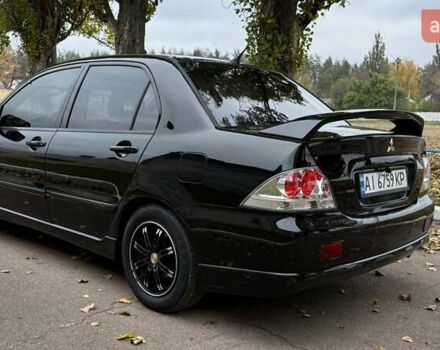 Чорний Міцубісі Lancer, об'ємом двигуна 1.58 л та пробігом 386 тис. км за 4450 $, фото 3 на Automoto.ua