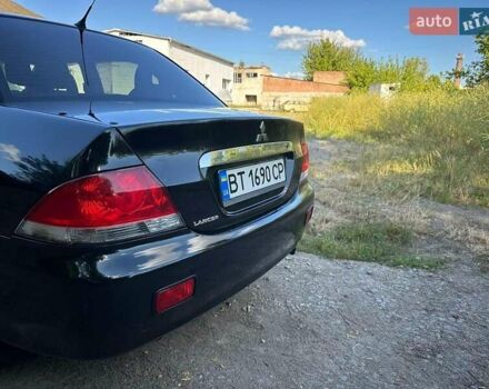 Мицубиси Лансер 2006 в Киеве на Automoto.ua Черный Мицубиси Лансер, объемом двигателя 1.58 л и пробегом 268 тыс. км за 3400 $, фото 4 на Automoto.ua
